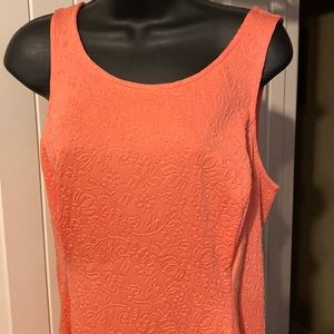 Floral embossed salon colored sleeveless dress with exposed brass zipper.
